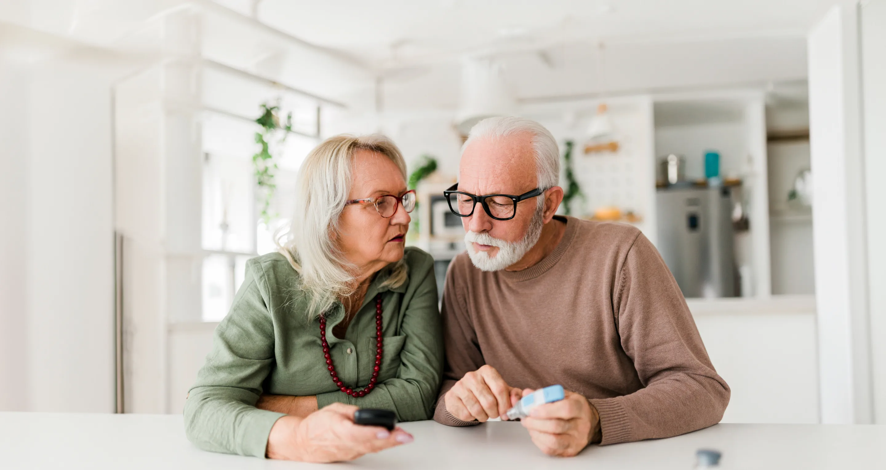 old couple reviewing results from medical device