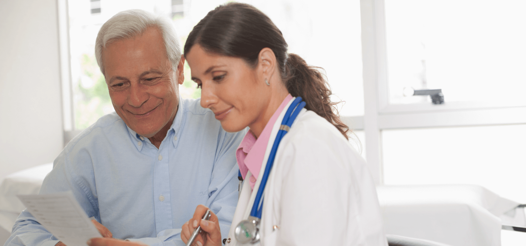 doctor and patient examining medical charts