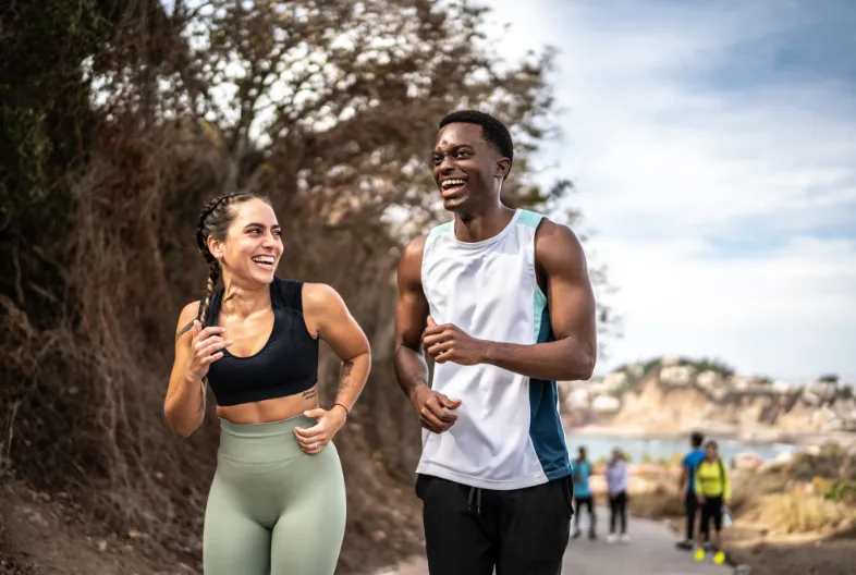 Man and women hanging out while out on a walk
