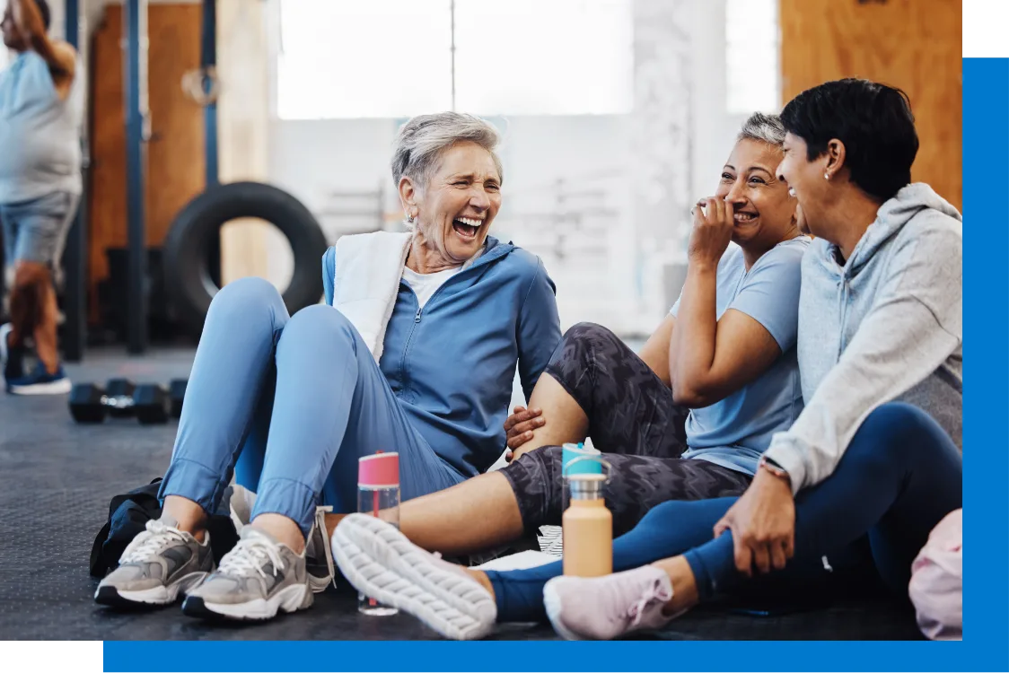 Women laughing during exercise at the gym