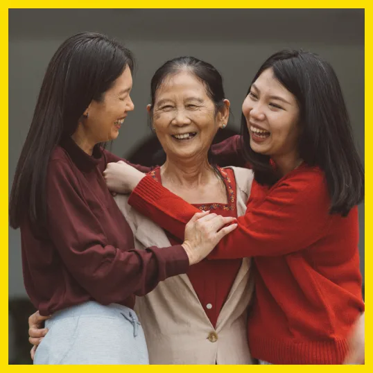 three generations of women hugging