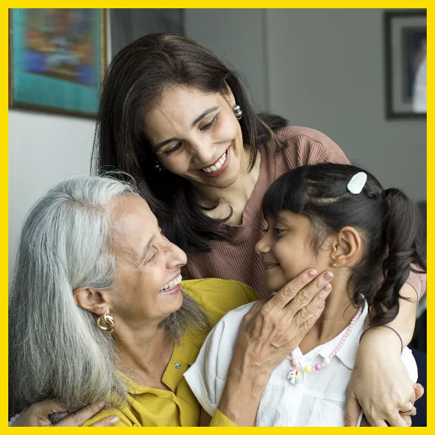 three generations of women hugging