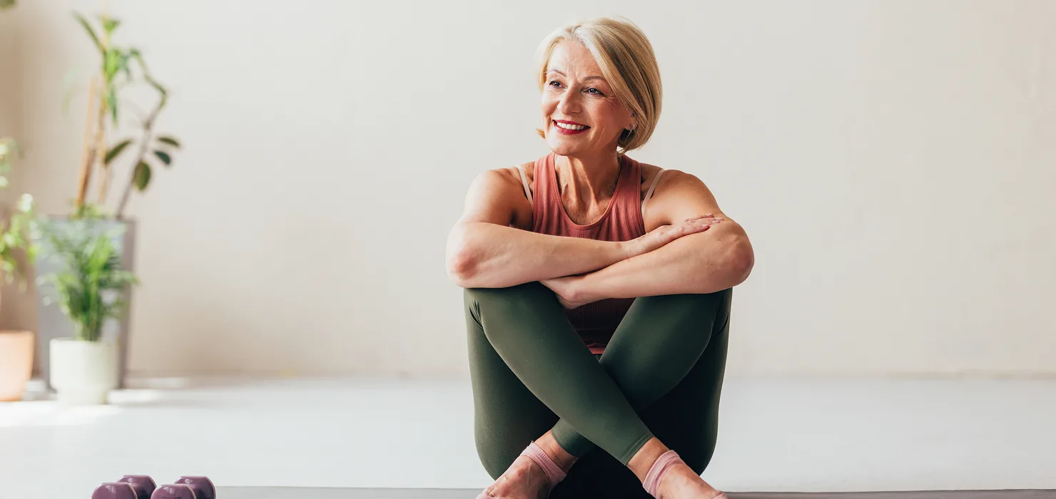 young black African American couple smilingwhile they cook in the kitchen