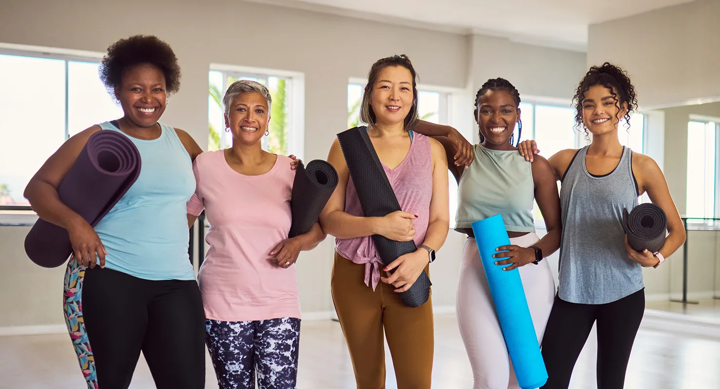 young black African American couple smilingwhile they cook in the kitchen