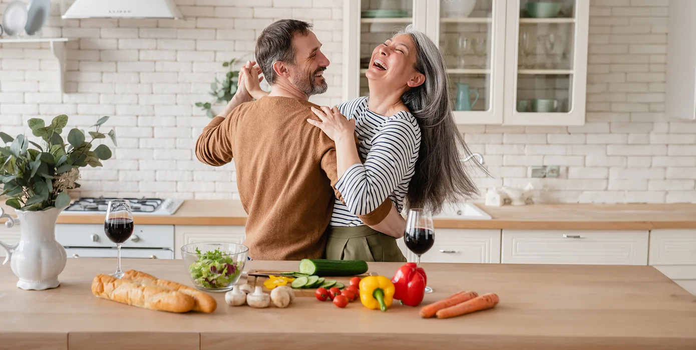 young black African American couple smiling, showing their bandages after getting vaccinated