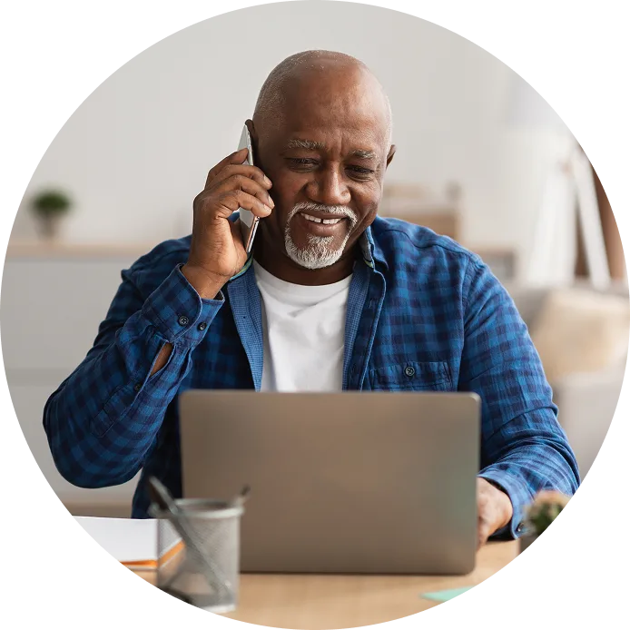 picture of a woman smiling while her blood pressure is checked in a doctor's office