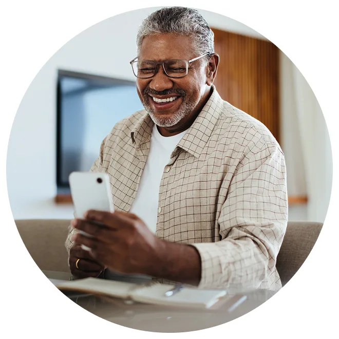 image shows an older Asian man holding his hands over his stomach as if he were feeling pain