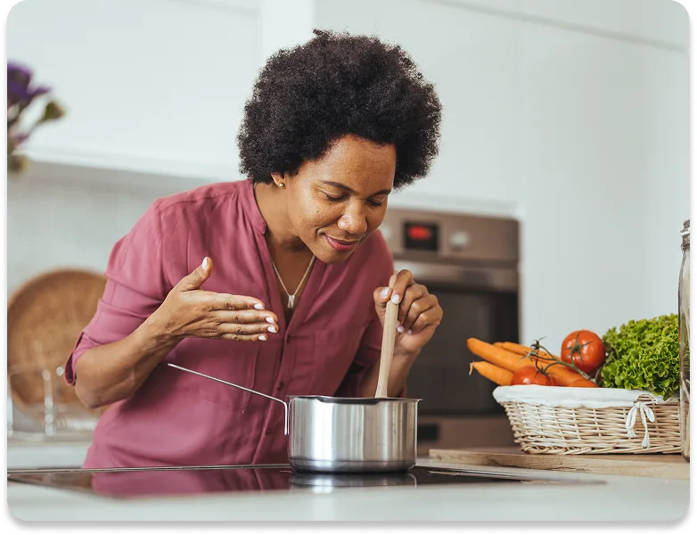 woman cooks food in her kitchen