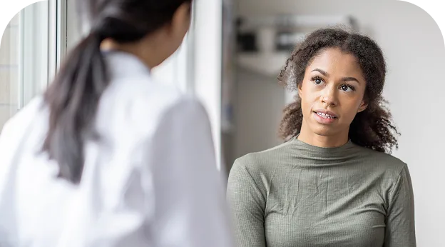 image of a young woman speaking with her Dr.