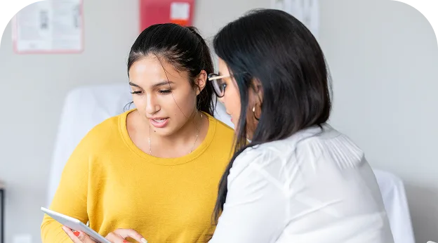 photo of a woman speaking with her healthcare provider