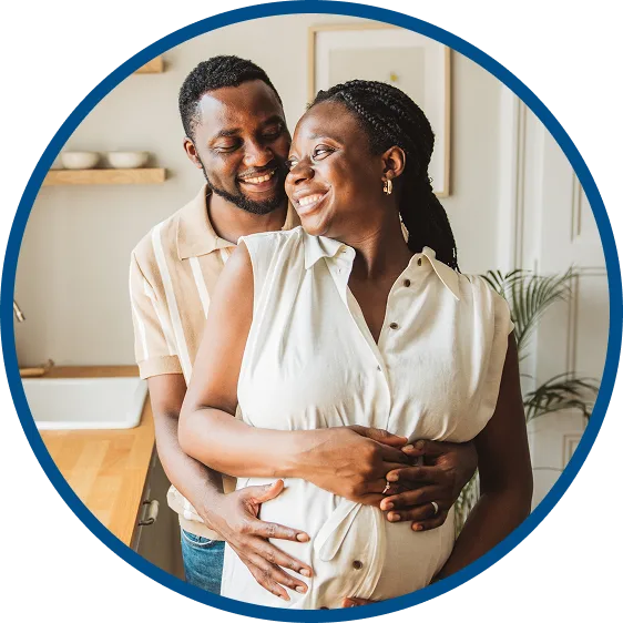picture of a woman smiling while sitting on an exam table