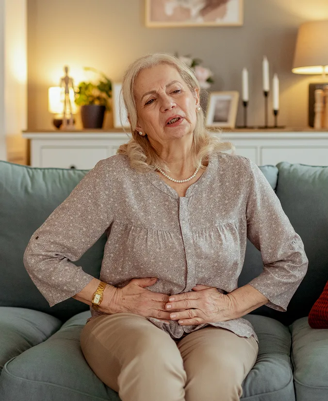 image of an older Aisan man performing stretches while seated