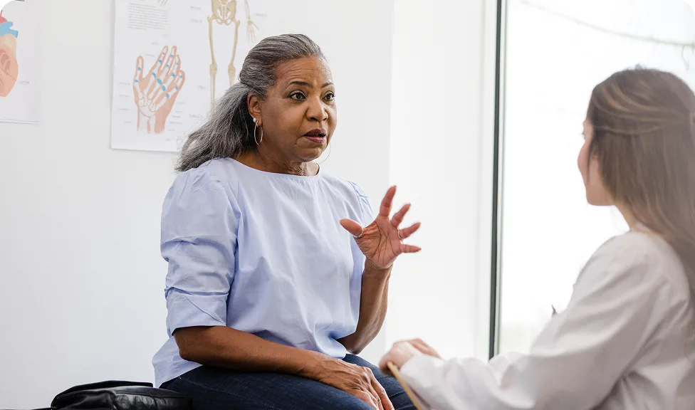 woman speaking with her provider in-office