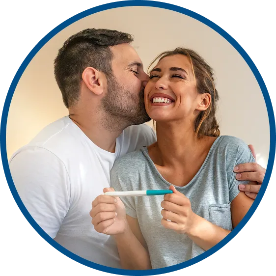 picture of a woman smiling while sitting on an exam table