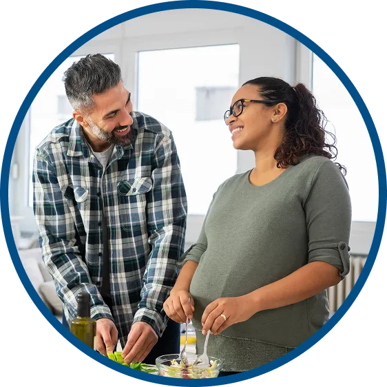 image of a man & woman couple smiling & talking with one another