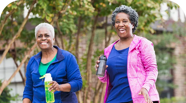 image of two older women walking together outside