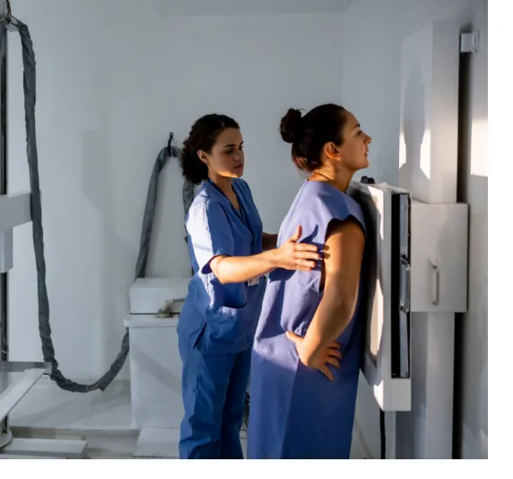 Nurse Technician and patient taking chest X-rays